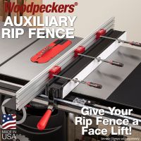 The Auxiliary Rip Fence installed on a Sawstop rip fence with track clamps in the standard, high fence orientation and the material support installed on the infeed.