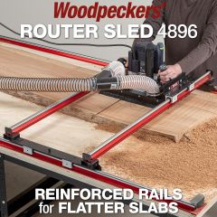 A large live edge slab on a table being flattened with the Router Sled 4896.
