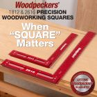 Woodpeckers 1812 and 2616 Precision Woodworking Squares resting on a mahogany board.